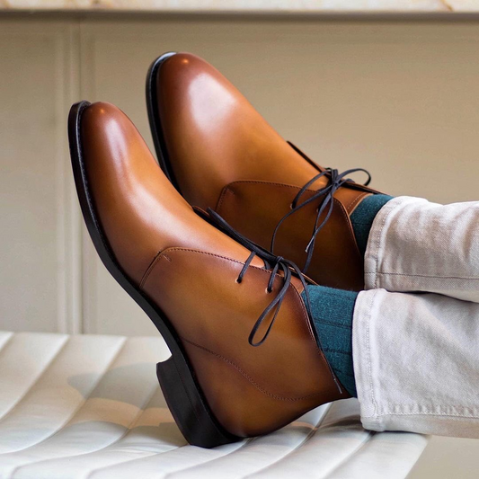 Featuring light-burnished cognac painted calf chukka boots